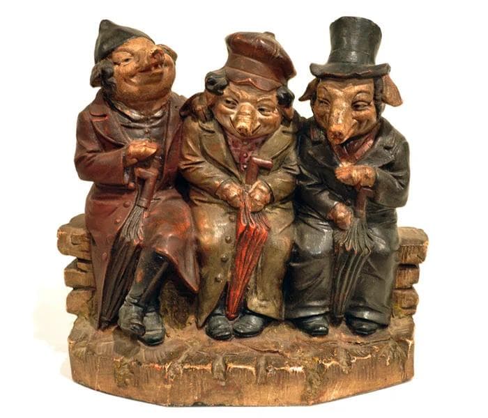 A late-19th-century statue from Czechoslovakia portrays pigs sitting in Jewish garb.